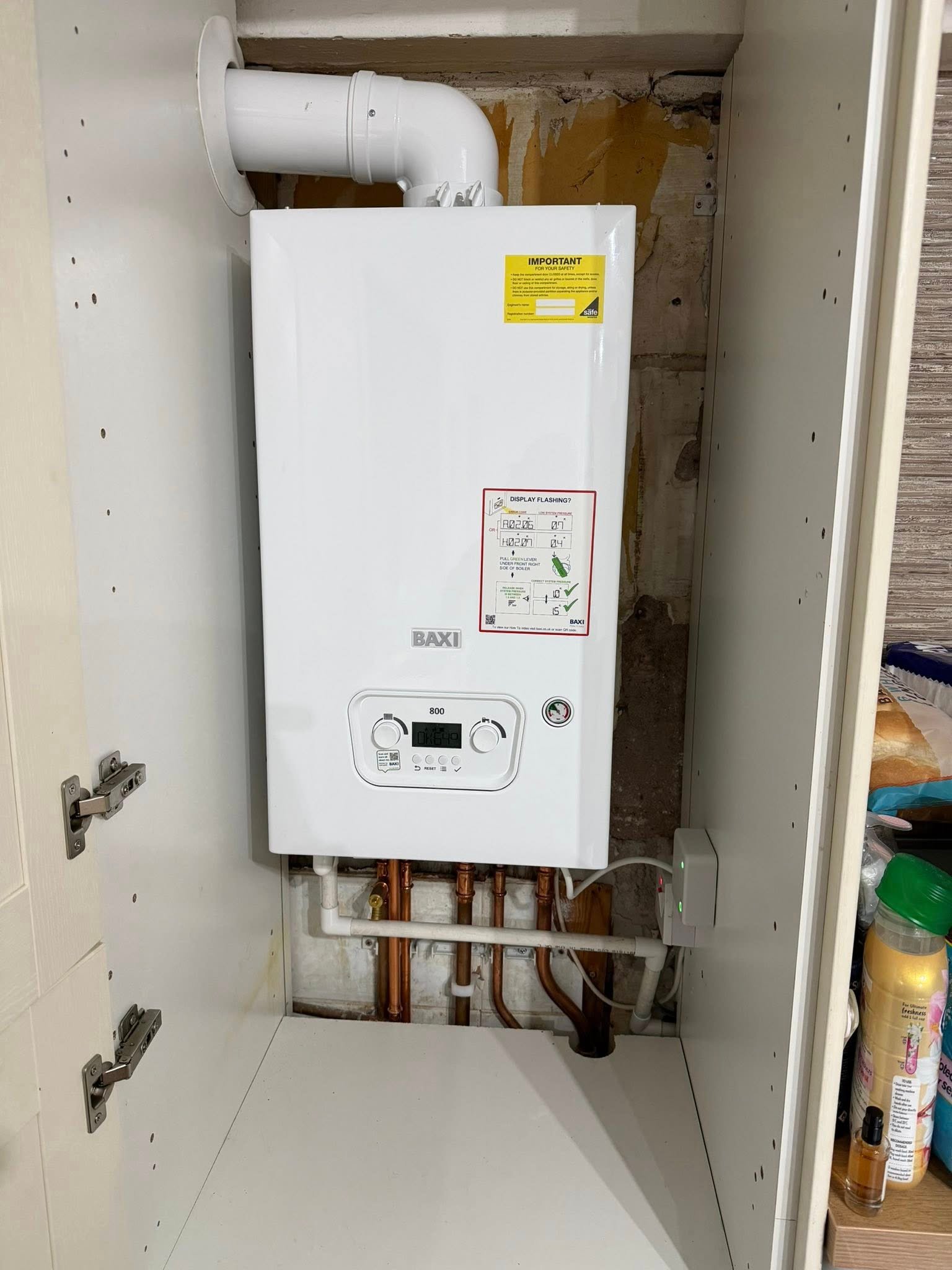 Baxi boiler installed inside a cabinet