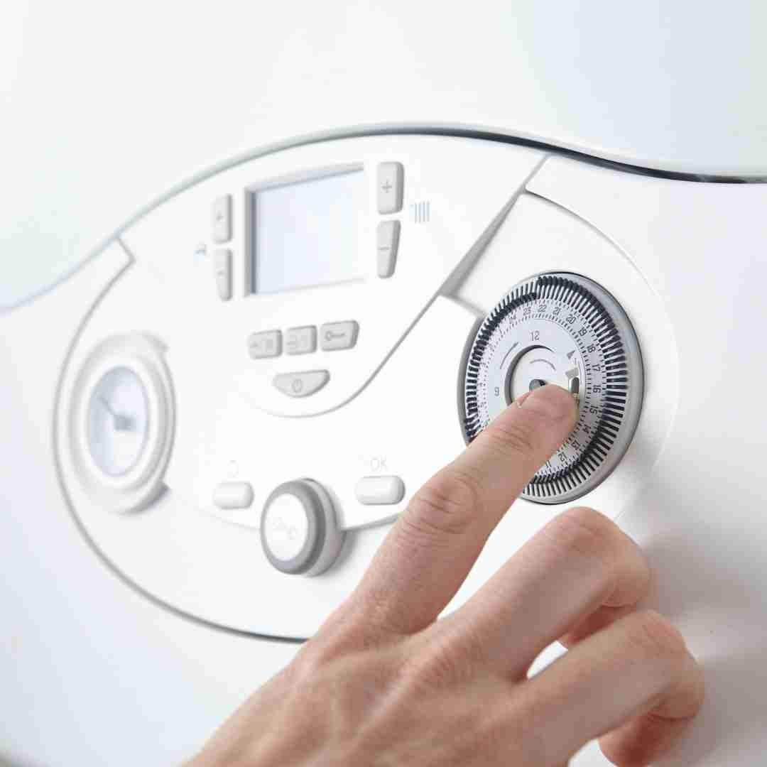 Gas engineer carrying out boiler servicing in Fife