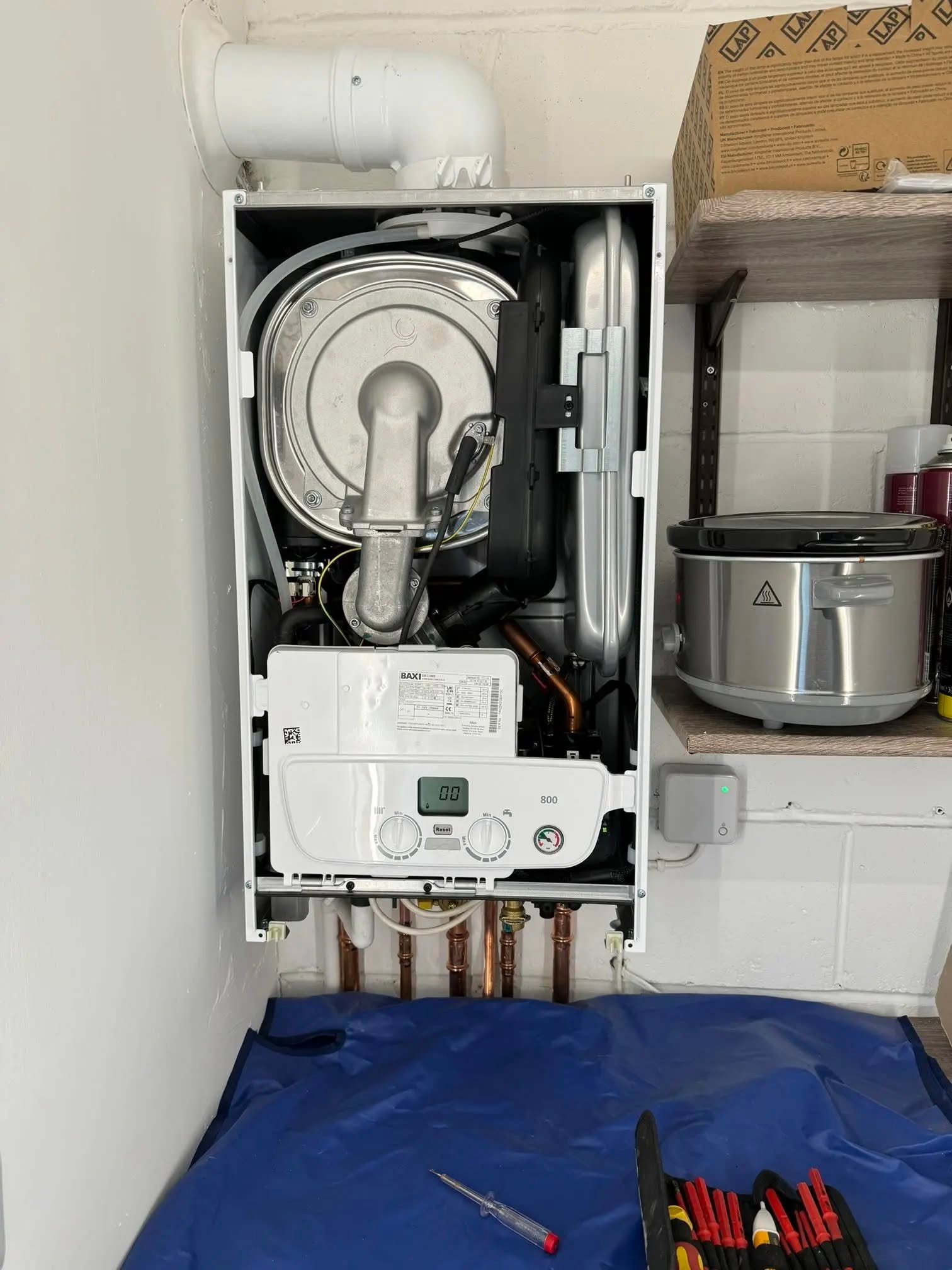 Gas-safety check being completed on a boiler in Fife